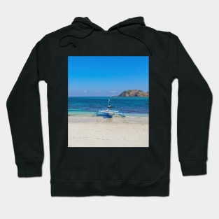 A paradise lagoon beach with a blue longtail boat Hoodie